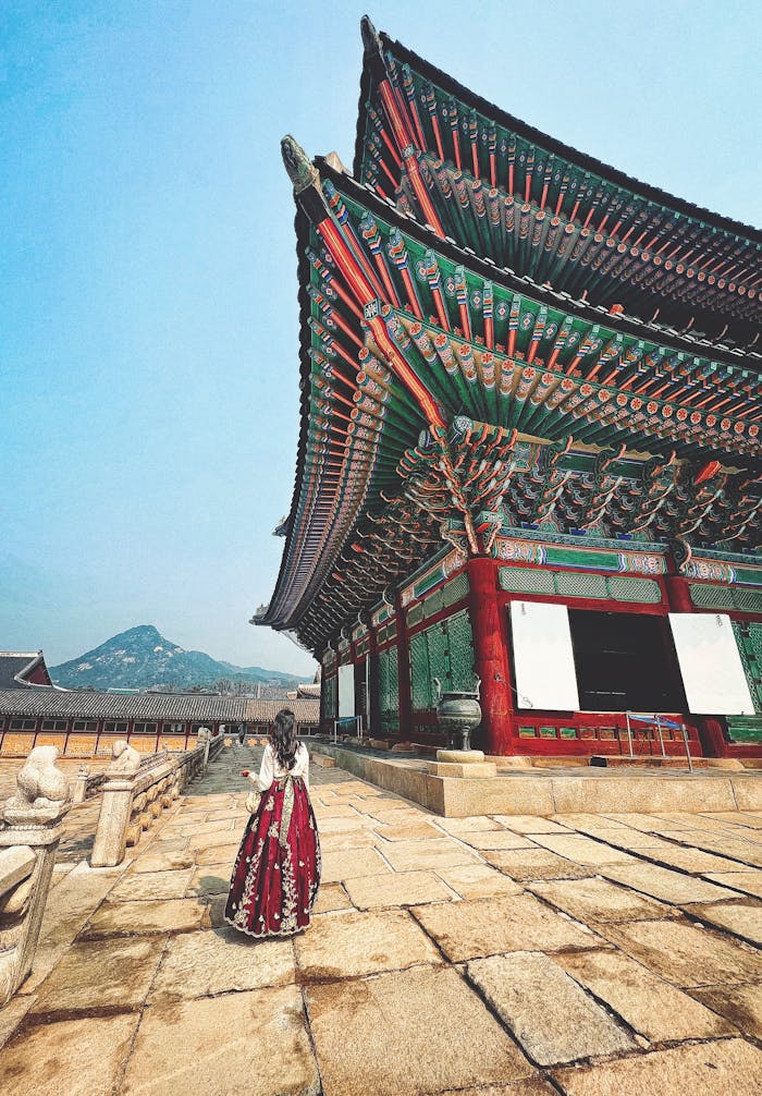 Explore the historic beauty of Gyeongbokgung Palace in Seoul, featuring traditional Hanbok clothing.